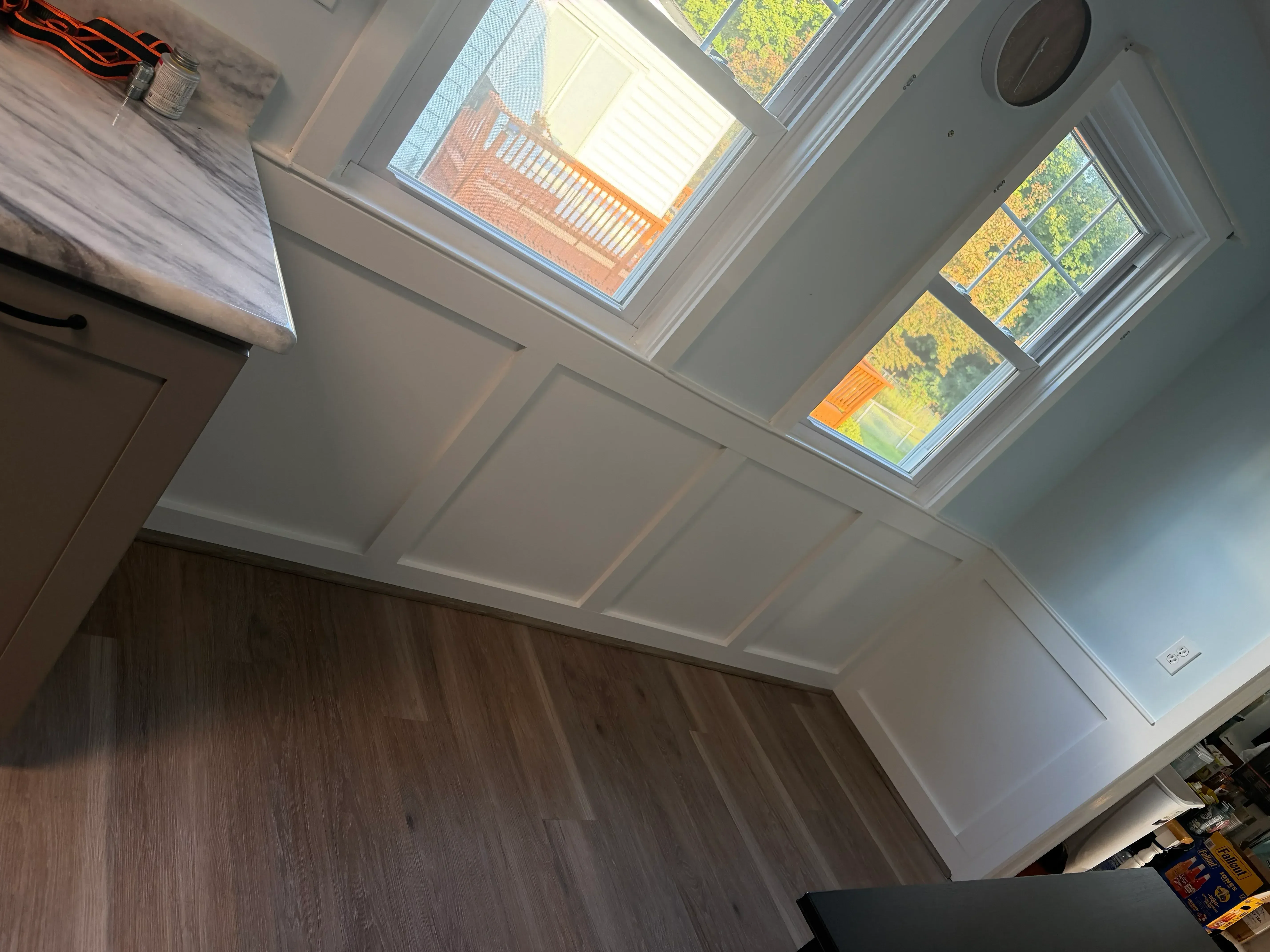 Interior room with installed windows, white drywall, and dark wood ceiling